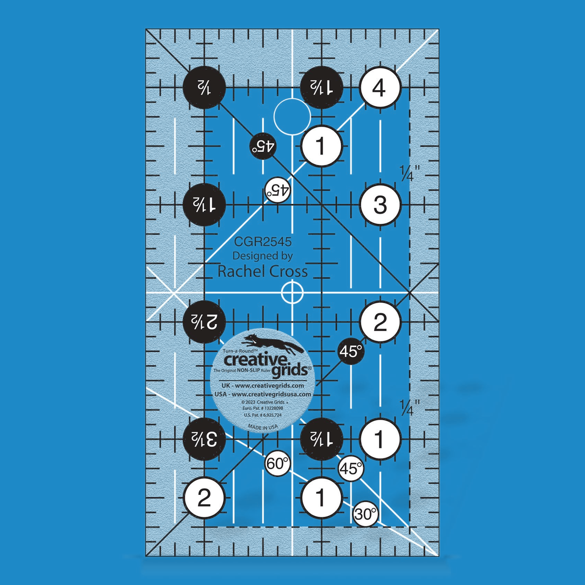 Creative Grids 2-1/2 x 4-1/2 inch rectangle quilt ruler CGR2545 by Rachel Cross rendered in translucent blue acrylic with black and white grid markings, whole-inch numbers in white dots, half-inch Turn-a-Round numbers in black dots, crossed 45 degree lines, a 30/60 degree line, a 1/4 inch dashed seam line, and white centering lines.