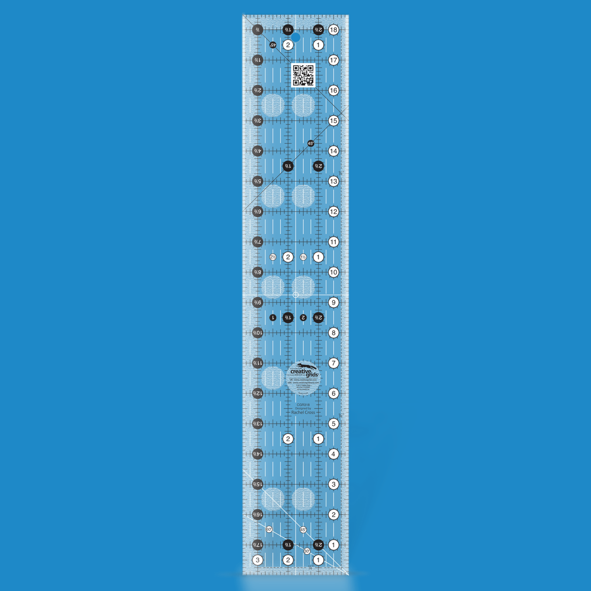 Creative Grids 3-1/2 x 18-1/2 inch rectangle quilt ruler CGR318 by Rachel Cross rendered in translucent blue acrylic with black and white grid markings, whole-inch numbers in white dots, half-inch Turn-a-Round numbers in black dots, crossed 45 degree lines, a 30/60 degree line, a 1/4 inch dashed seam line, and white centering lines.