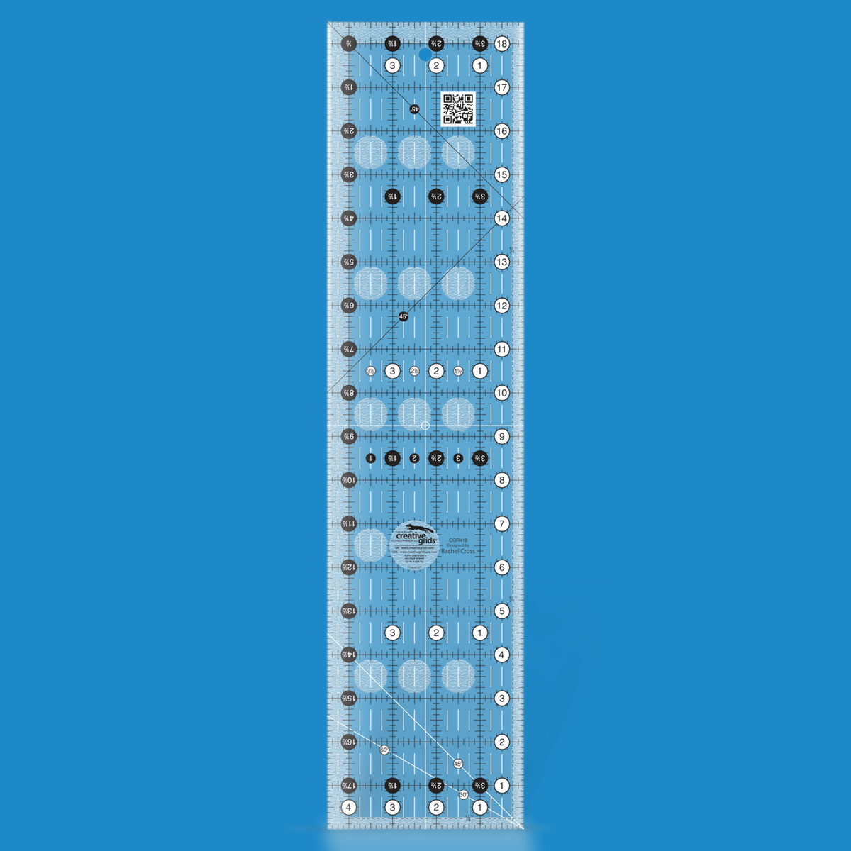 Creative Grids 4-1/2 x 18-1/2 inch rectangle quilt ruler CGR418 by Rachel Cross rendered in translucent blue acrylic with black and white grid markings, whole-inch numbers in white dots, half-inch Turn-a-Round numbers in black dots, crossed 45 degree lines, a 30/60 degree line, a 1/4 inch dashed seam line, and white centering lines.