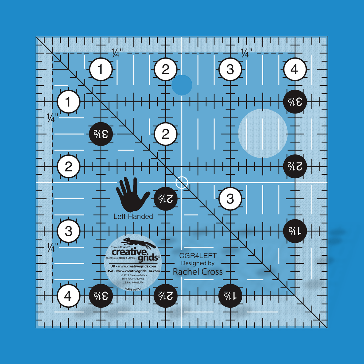 Creative Grids left handed 4-1/2 inch square quilt ruler CGR4LEFT by Rachel Cross rendered in translucent blue acrylic with black and white grid markings mirrored for left-handed cutting, whole-inch numbers in white dots on the top and left, half-inch Turn-a-Round numbers in black dots, a 45 degree diagonal, a 1/4 inch dashed seam line, white centering lines, and a left-hand icon.
