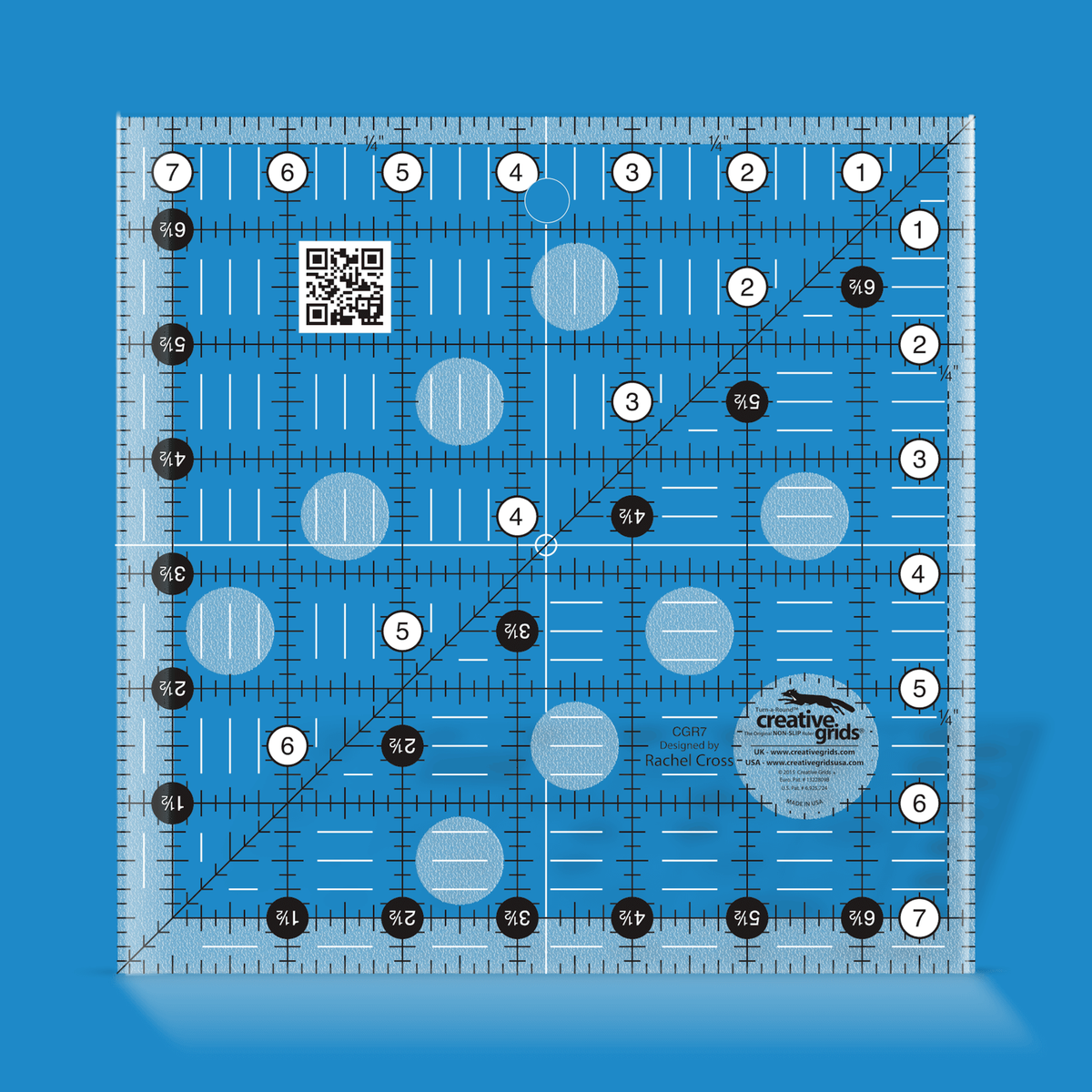 Creative Grids 7-1/2 inch square quilt ruler CGR7 by Rachel Cross rendered in translucent blue acrylic with black and white grid markings, whole-inch numbers in white dots, half-inch Turn-a-Round numbers in black dots, a 45 degree diagonal, a 1/4 inch dashed seam line, and white centering lines.