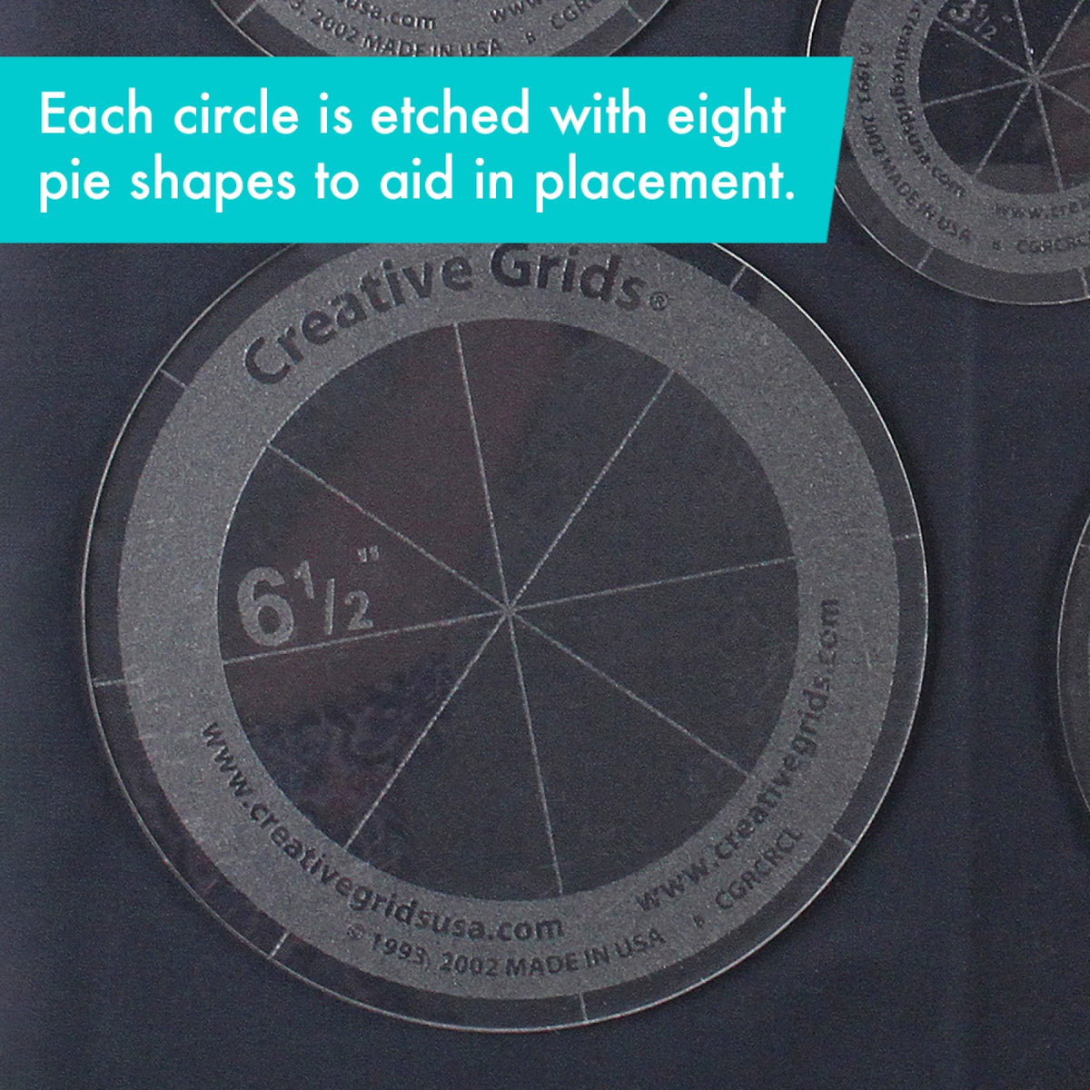 Close view of the 6 1/2 inch circle from the Creative Grids Circles Set of 5 CGRCRCL on dark fabric: a clear center with four lines that cross to make eight sections, a frosted grip ring with the Creative Grids name, two website addresses, and the item number, and a clear rim with short tick marks in line with the lines. A caption says each circle has eight etched pie shapes to aid in placement.