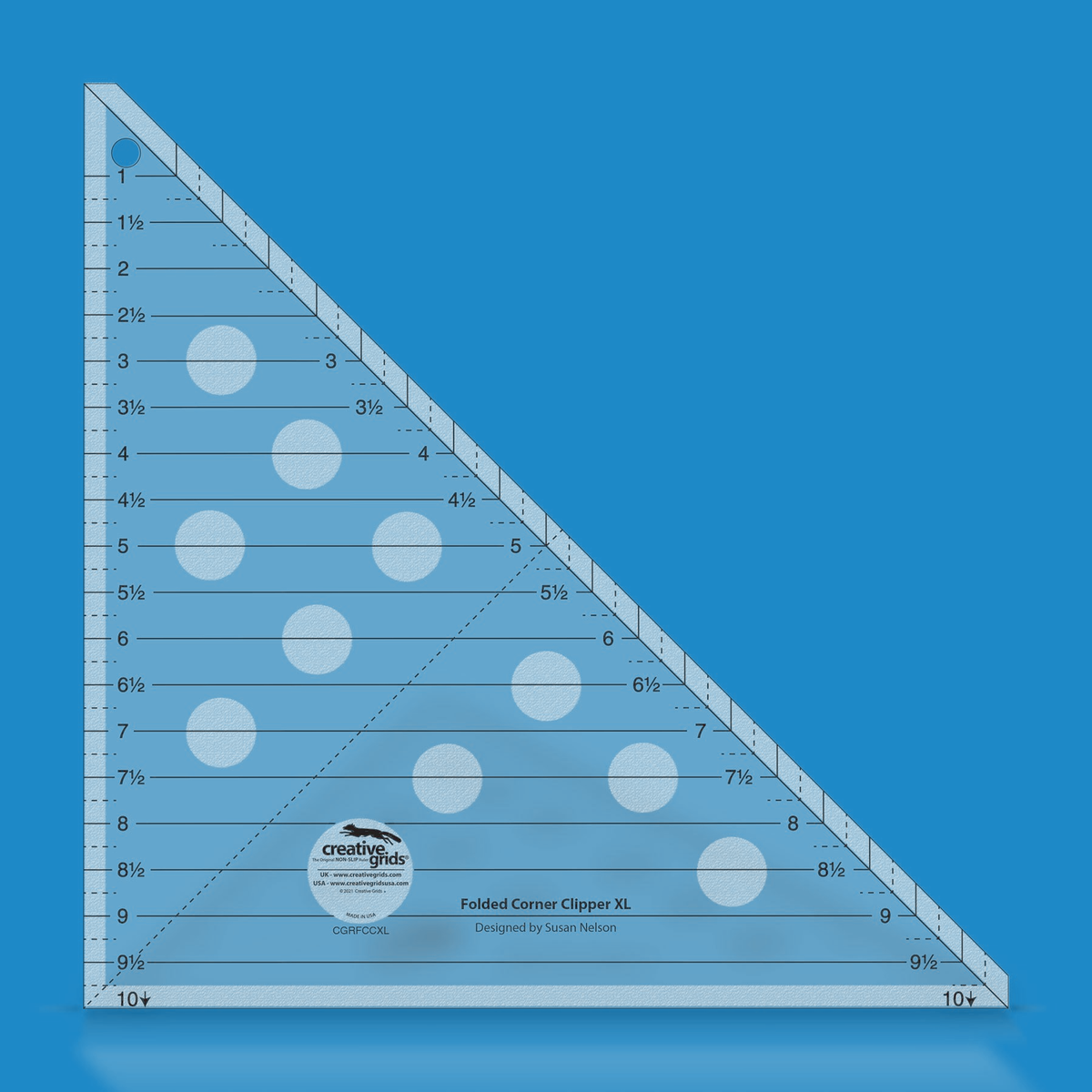 Creative Grids Folded Corner Clipper Tool XL CGRFCCXL by Susan Nelson in translucent blue acrylic with solid horizontal lines labeled 1 to 9 1/2, a 10 with an arrow at each bottom corner, a solid diagonal line, a dashed line from the lower left corner to the diagonal, and the Designed by Susan Nelson credit.