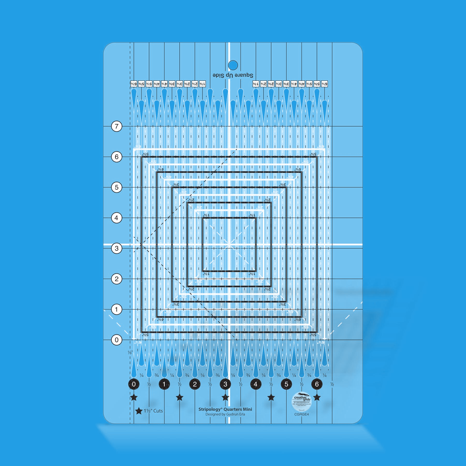 Stripology Quarters Mini quilt ruler by Gudrun Erla for Creative Grids shown in translucent blue acrylic, highlighting the quarter-inch cutting slits, flying geese trim lines, and non-slip grip surface of the 8 1/2 x 12 1/2 inch ruler.