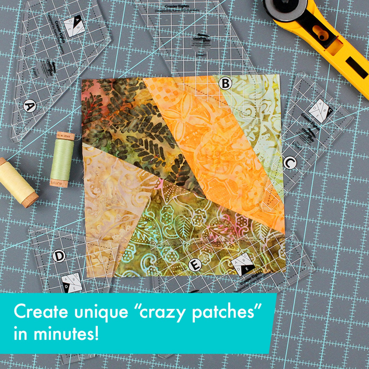 One Crazier Eights crazy patch block in five batik fabrics on a gray cutting mat, with the five clear Creative Grids Crazier Eights Templates CGRMT7 lettered A to E around it, spools of thread, and a yellow rotary cutter. A caption says the templates make crazy patches in minutes.