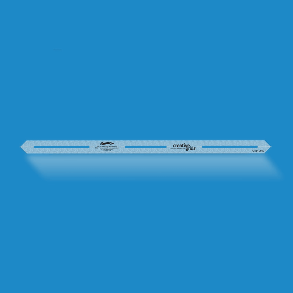 Creative Grids 9-Inch Seam Guide Tool CGRSMN9 by It's Sew Emma in translucent blue acrylic, a narrow strip with pointed ends, three marking slots along the center, and the Creative Grids logo.