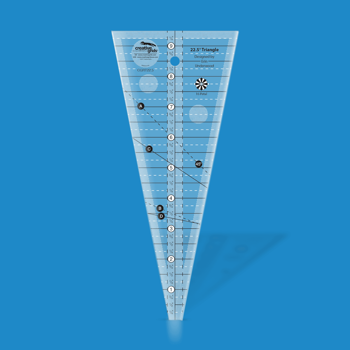 Creative Grids 22 1/2 Degree Triangle CGRT225 by Erin Underwood in translucent blue acrylic, a wedge with a center inch scale to 9 1/4 inches, dashed and solid angled guide lines, a 16 Petal plate icon, a hang hole, and the Designed by Erin Underwood credit.