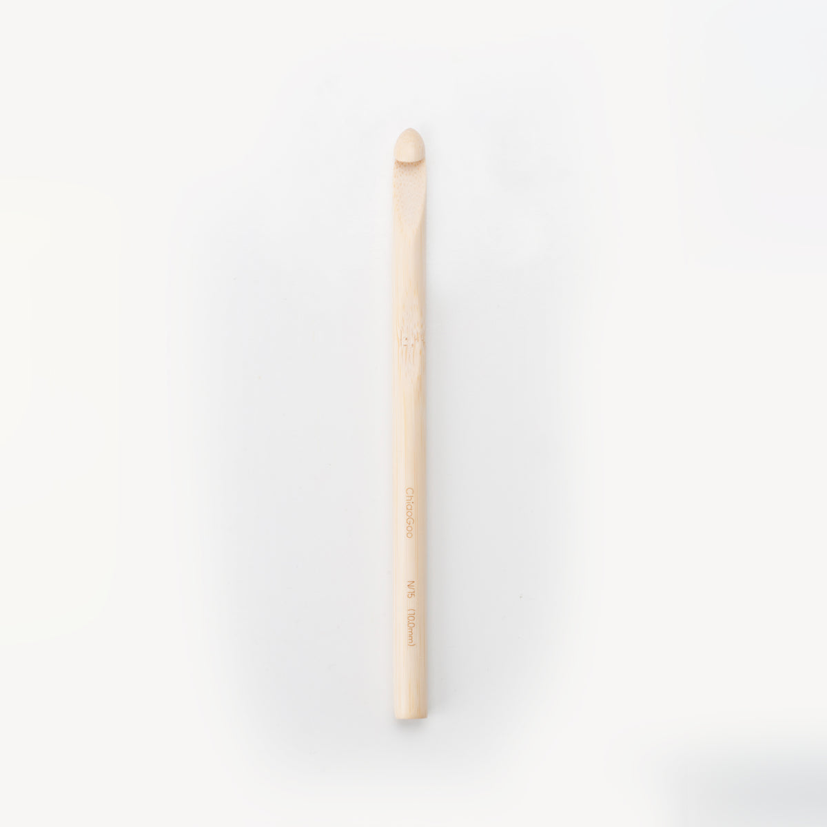 ChiaoGoo bamboo crochet hook, upright on a light gray background with the hook at the top. The pale natural bamboo shaft carries the markings ChiaoGoo and N/15 (10.0mm).