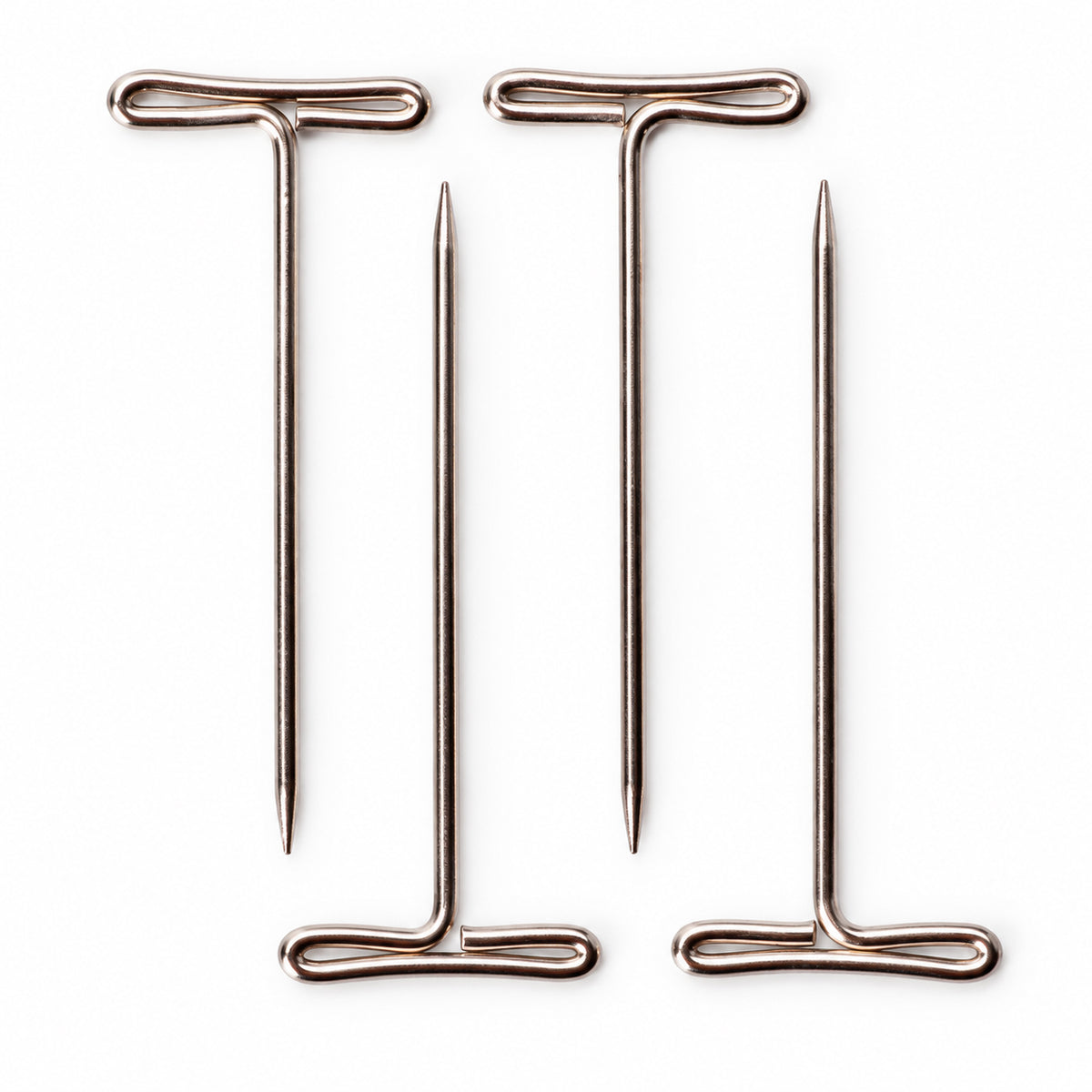 Four ChiaoGoo tightening keys for Small [S] and Large [L] cables on a white background, two with the handle at the top and two with the handle at the bottom. Each T-shaped wire key has a flat looped handle at one end and a thin tapered point at the other.