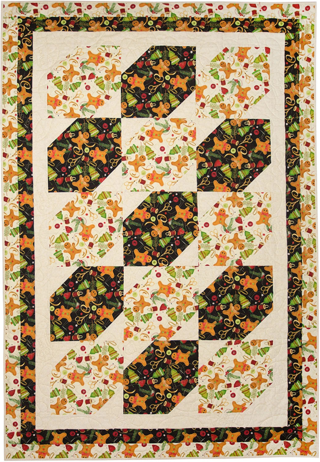 Favorite Things quilt from Make It Christmas with 3-Yard Quilts by Fabric Cafe. Large blocks of a black and cream gingerbread-man print with snowball-cut corners run across the quilt, framed by a gingerbread print border.