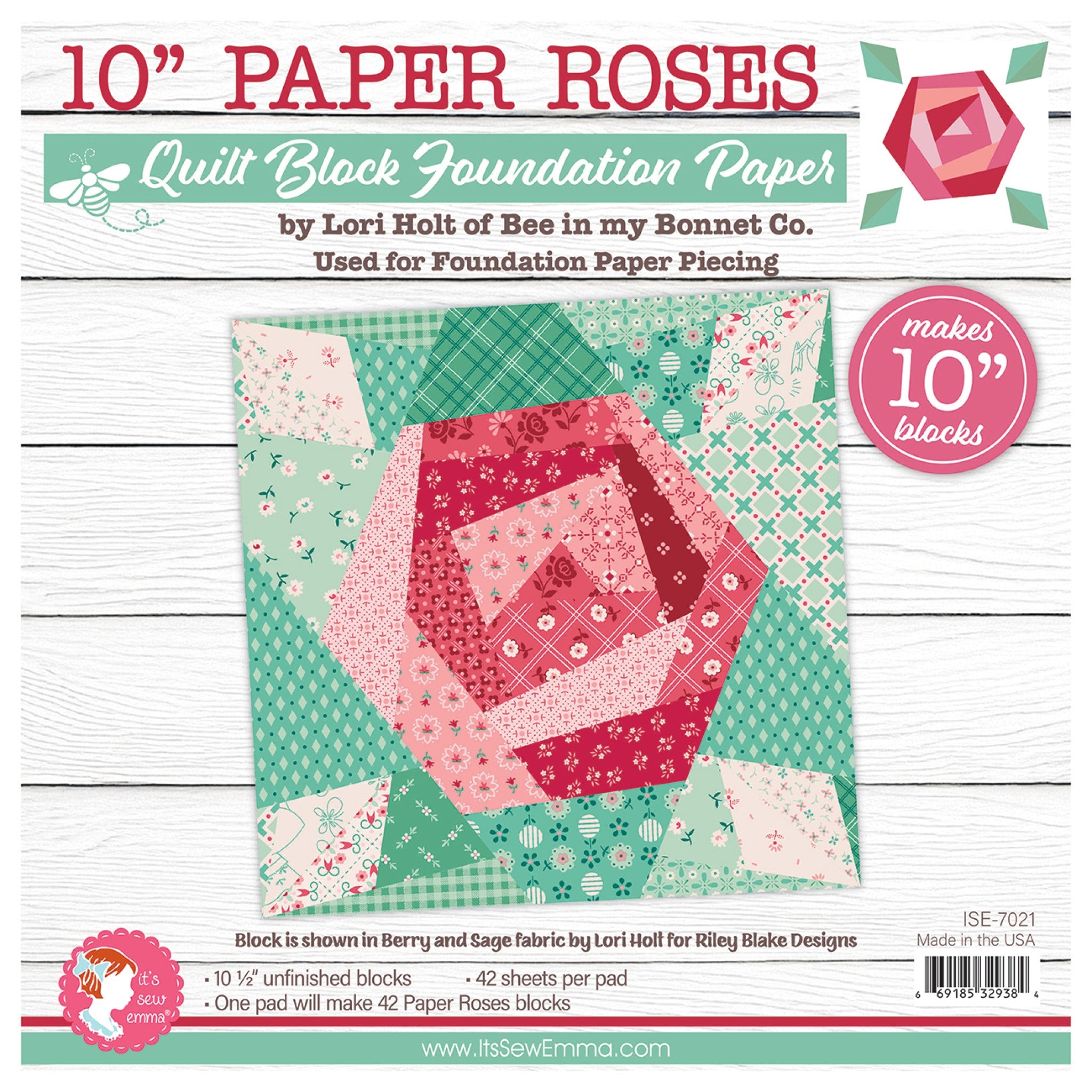 Front cover of It's Sew Emma's Paper Roses 10-Inch Quilt Block Foundation Paper Pad by Lori Holt of Bee in my Bonnet Co. Shows a pieced rose block in pink, coral, and berry florals on a sage and teal background, made from Lori Holt's Berry and Sage fabric for Riley Blake Designs. The pad makes 42 finished blocks at 10 inches square (10 1/2 inches unfinished). SKU ISE-7021. Made in the USA.