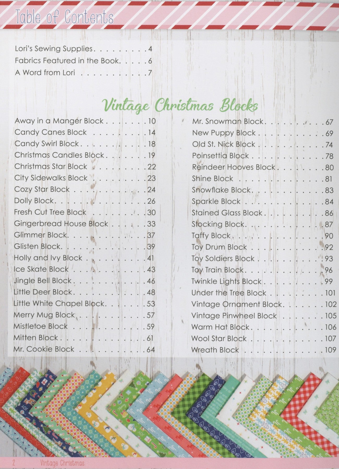 Table of Contents page from Vintage Christmas by Lori Holt for It's Sew Emma, listing the 42 Christmas blocks from Away in a Manger to Wreath, with a fan of holiday fabrics along the bottom.
