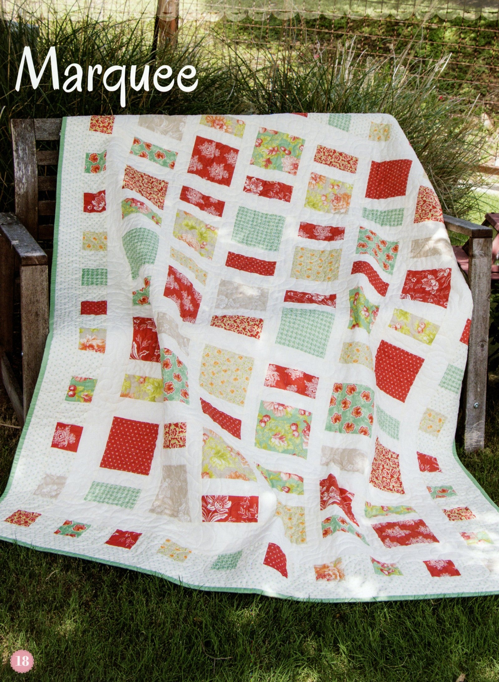 Marquee quilt from the Fat Quarter Style pattern book, squares and sashing in red, aqua, and green prints on a white background.