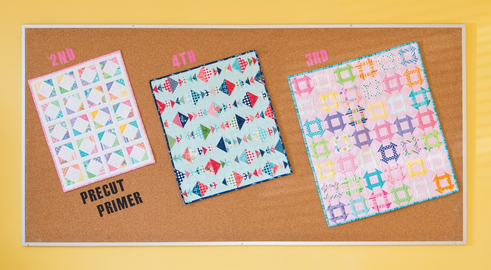 Three small quilts from Precut Primer displayed together in soft precut prints.