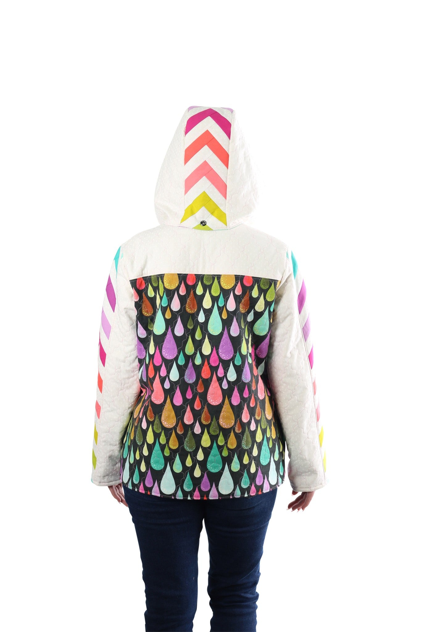 Back view of a person wearing a Bella Quilt Coat with the rainbow chevron hood up over a raindrop-print body.