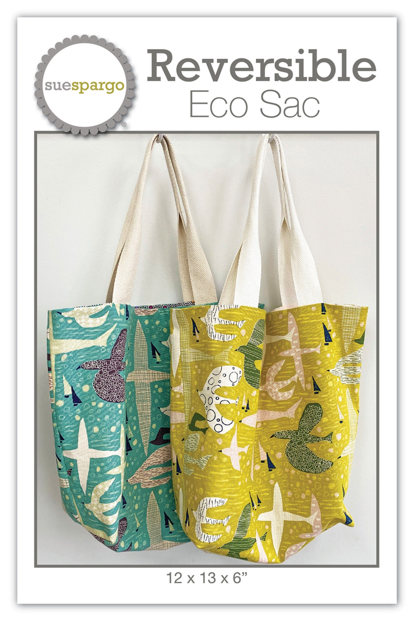 Reversible Eco Sac tote bag sewing pattern by Sue Spargo of Folk Art Quilts. Front cover shows two finished reversible tote bags, one teal and one chartreuse, sewn from printed cotton with canvas webbing handles. Finished size 12 by 13 by 6 inches.