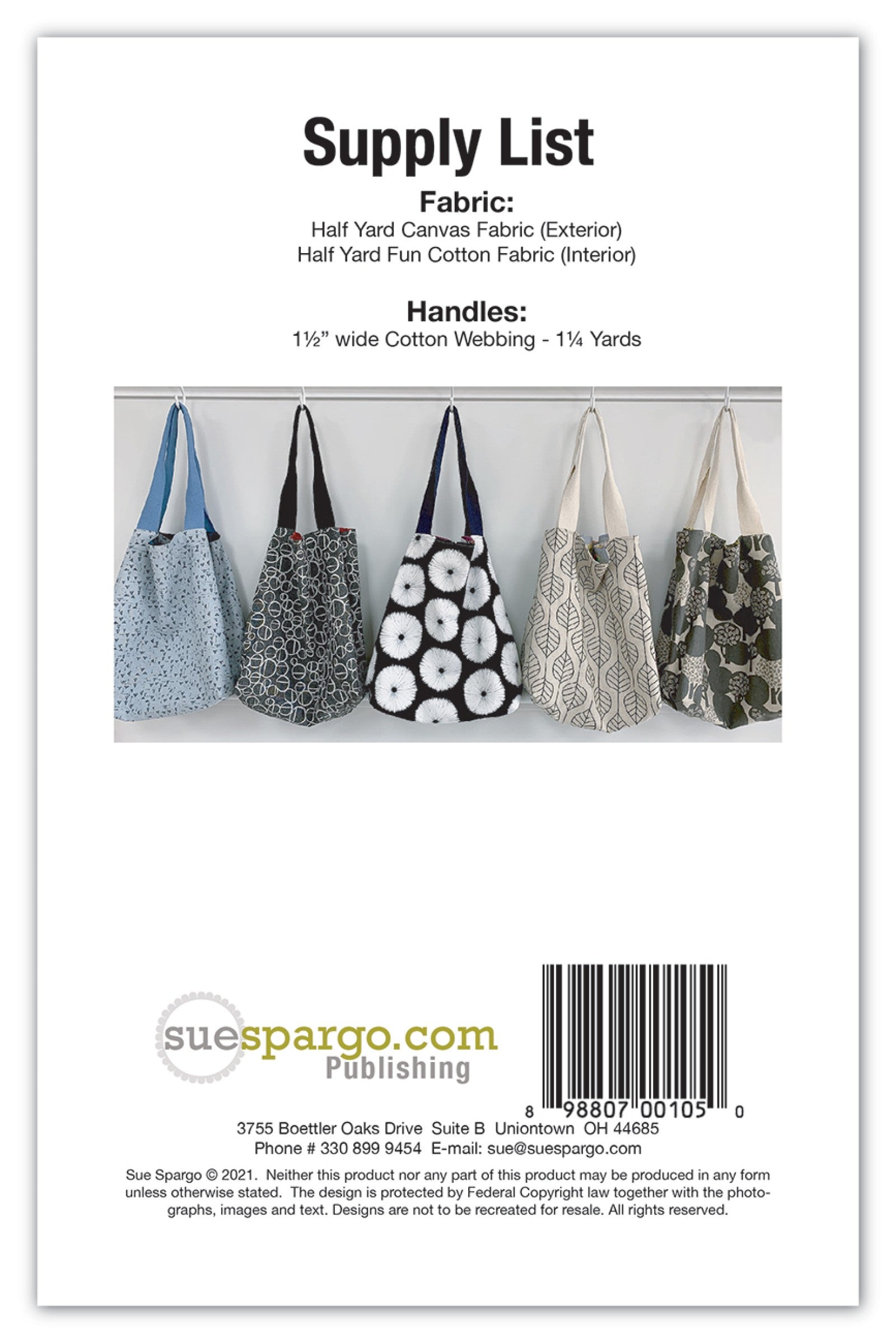 Back cover of the Reversible Eco Sac pattern by Sue Spargo of Folk Art Quilts. Supply list calling for a half yard of canvas, a half yard of cotton, and cotton webbing handles, with five more finished tote bags shown in different prints and the UPC barcode.