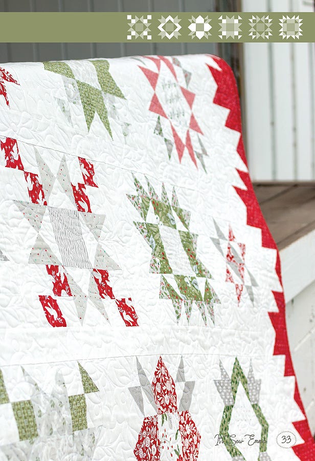 Close-up detail of Among the Stars Again star blocks and quilting texture in the Christmas colorway.