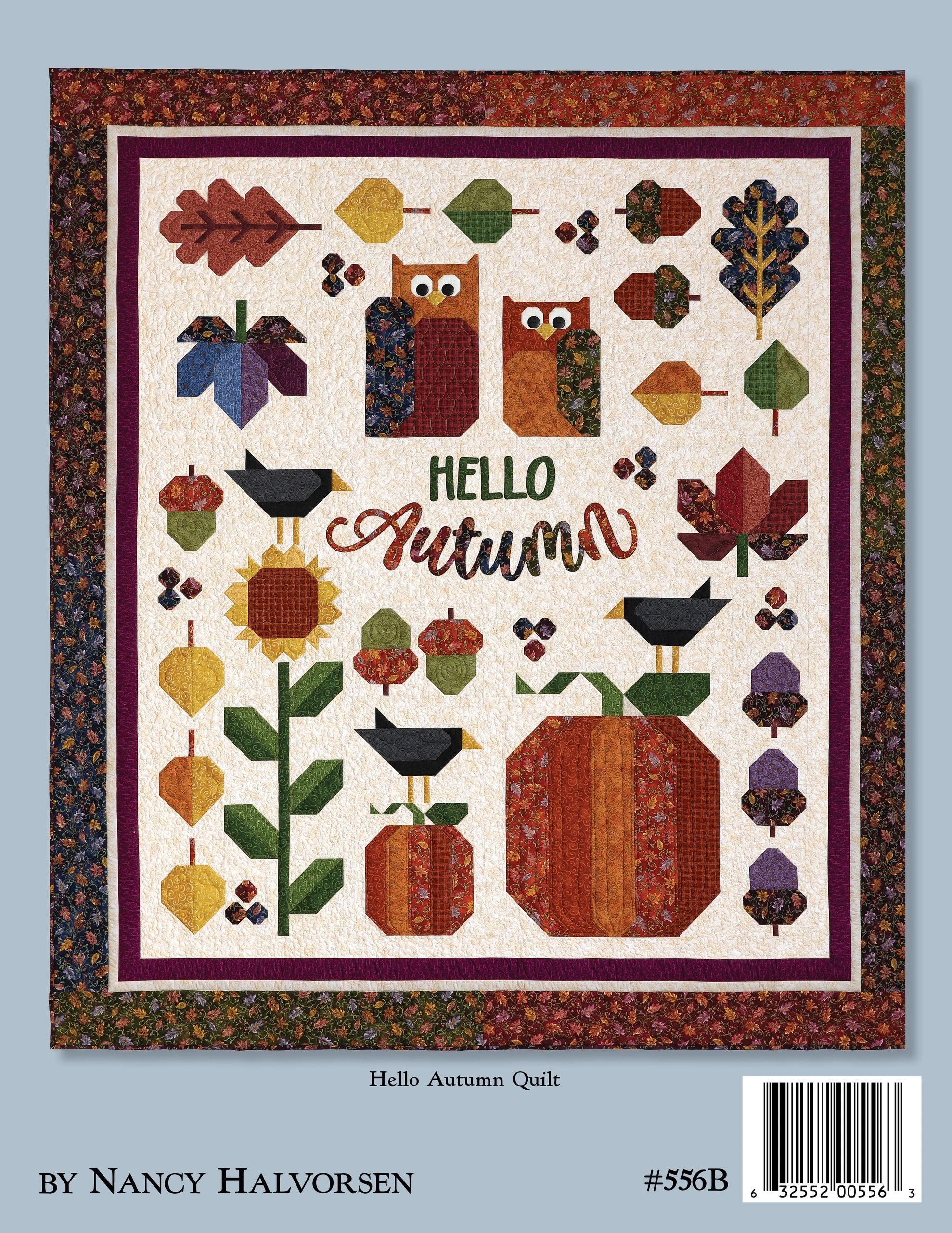 Back cover of the Autumn Breeze quilt pattern book by Nancy Halvorsen of Art to Heart, showing the Hello Autumn quilt: two owls, a sunflower, blackbirds, oak leaves, acorns, and pumpkins around pieced HELLO AUTUMN lettering on a cream background with an autumn-print border. Marked by Nancy Halvorsen, number 556B.