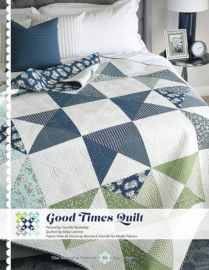Good Times Quilt from The Bonnie & Camille Quilt Bee, large navy and cream pieced blocks on a bed.