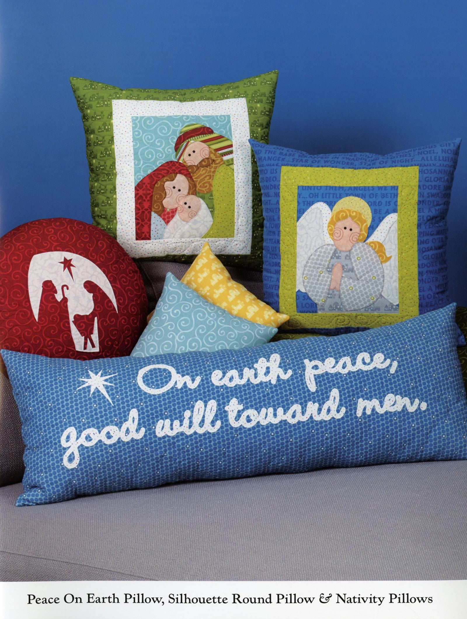 Interior page of the Christmas Pure And Simple quilt pattern book by Nancy Halvorsen of Art to Heart, showing the Peace On Earth Pillow, Silhouette Round Pillow, and Nativity Pillows.