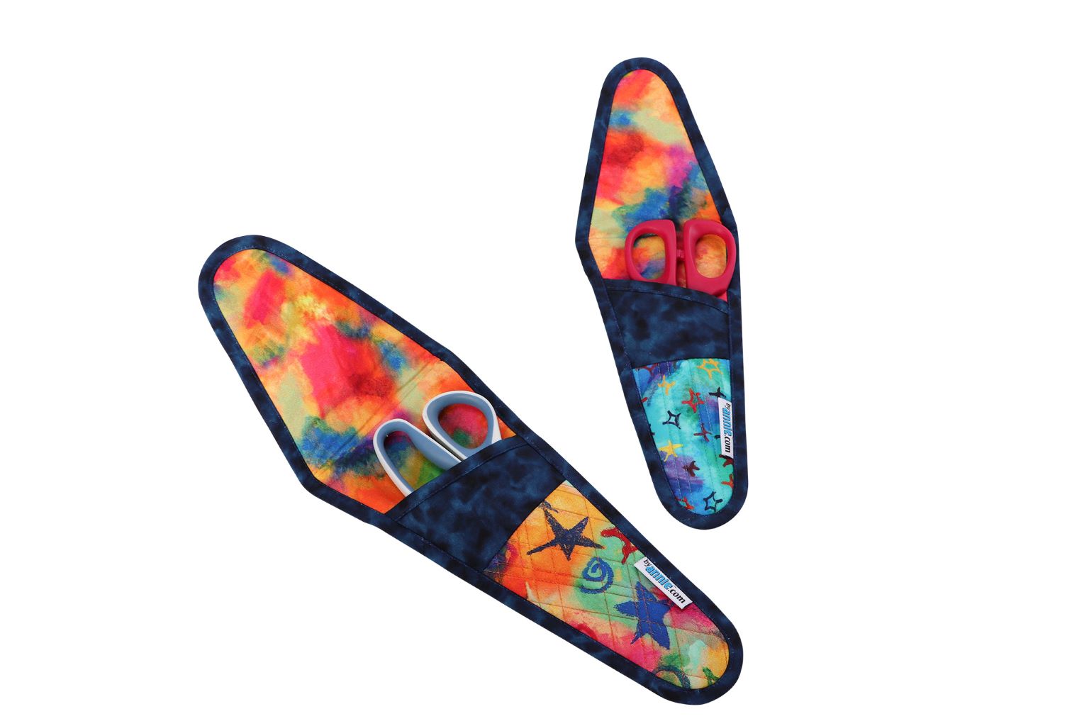Two Cut It Out scissors cases in tie-dye prints, open to show scissors inside.