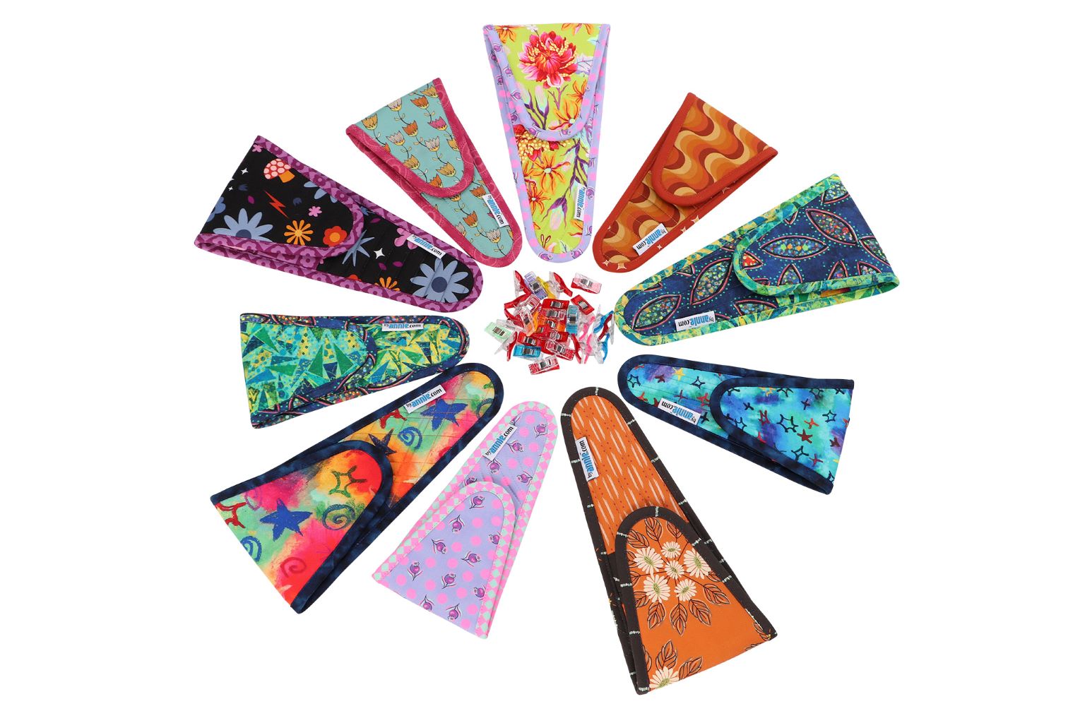 Many Cut It Out scissors cases in assorted prints arranged in a fan.
