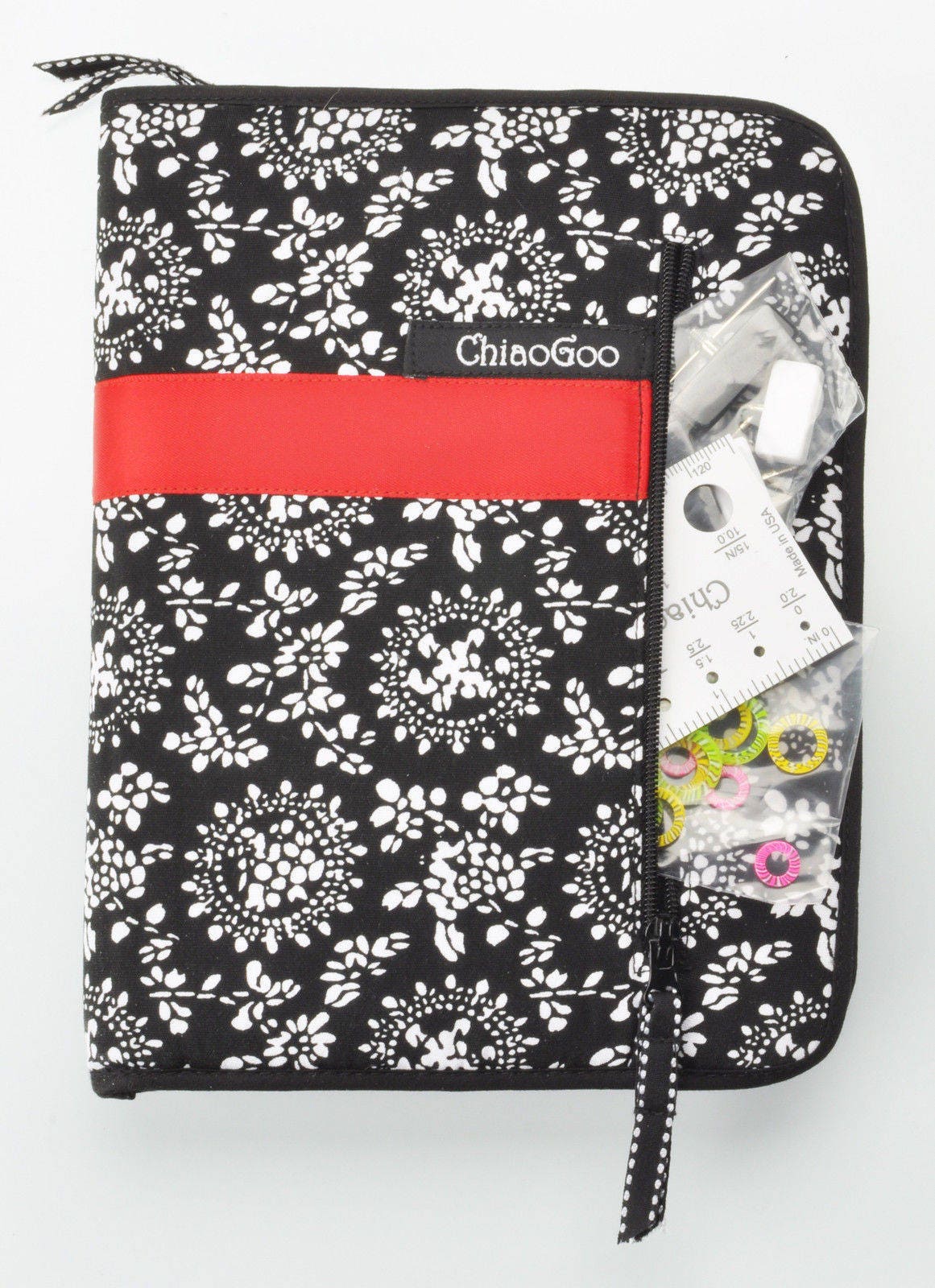 ChiaoGoo TWIST interchangeable set case closed, showing the outside zippered pocket holding the needle gauge, end stoppers, and stitch markers