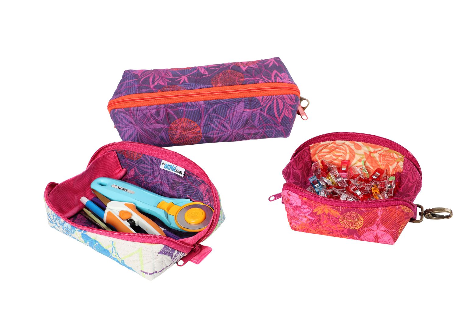 Drop Zone pouches opened out into shallow trays holding sewing notions and rotary tools.
