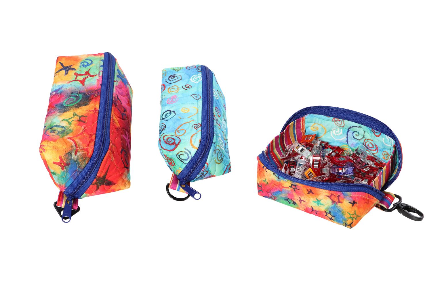 A Drop Zone pouch opened into a tray beside a closed one with a clip strap attached to the end hardware.