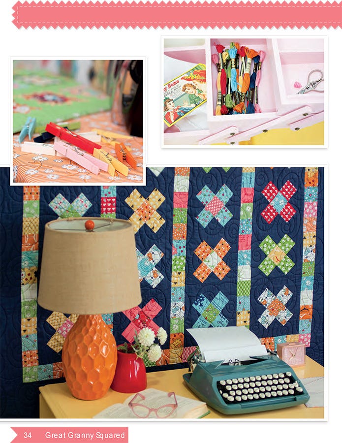 Interior page from the Great Granny Squared quilt pattern book by Lori Holt for It's Sew Emma, showing a scrappy granny-square quilt with cross blocks and a navy border styled behind an orange lamp, a teal vintage typewriter, and red eyeglasses, with two small inset photos of colored clips and marking pencils.