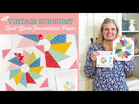 Video tutorial from It's Sew Emma showing how to sew the Vintage Sunburst quilt block with Lori Holt's foundation paper. Fabric wedges are added to each numbered section of a quadrant sheet, trimmed, and pressed, then four finished quadrants are joined into the complete sunburst block.