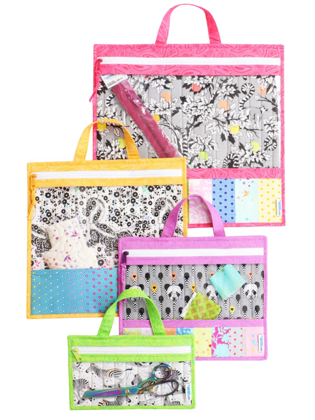 Four Project Bags stacked from small to jumbo, each with a top handle and a clear vinyl front showing the contents.