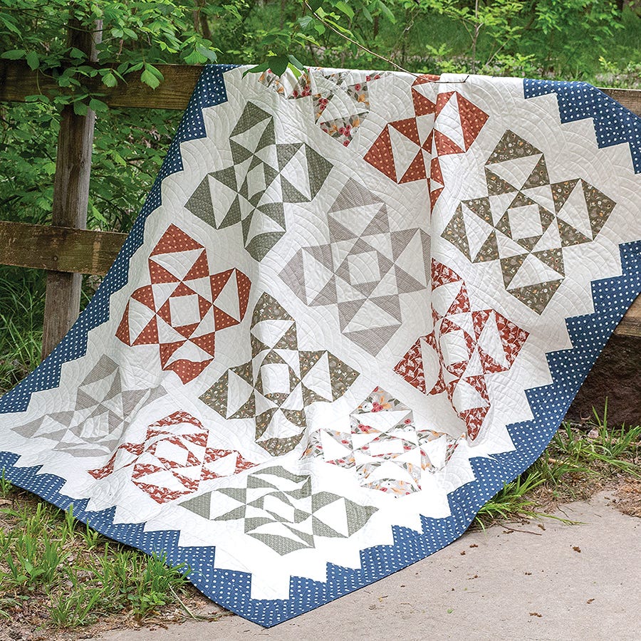 Woodland Quilt from Simply Half Yards, taupe and rust pieced blocks with a navy border.
