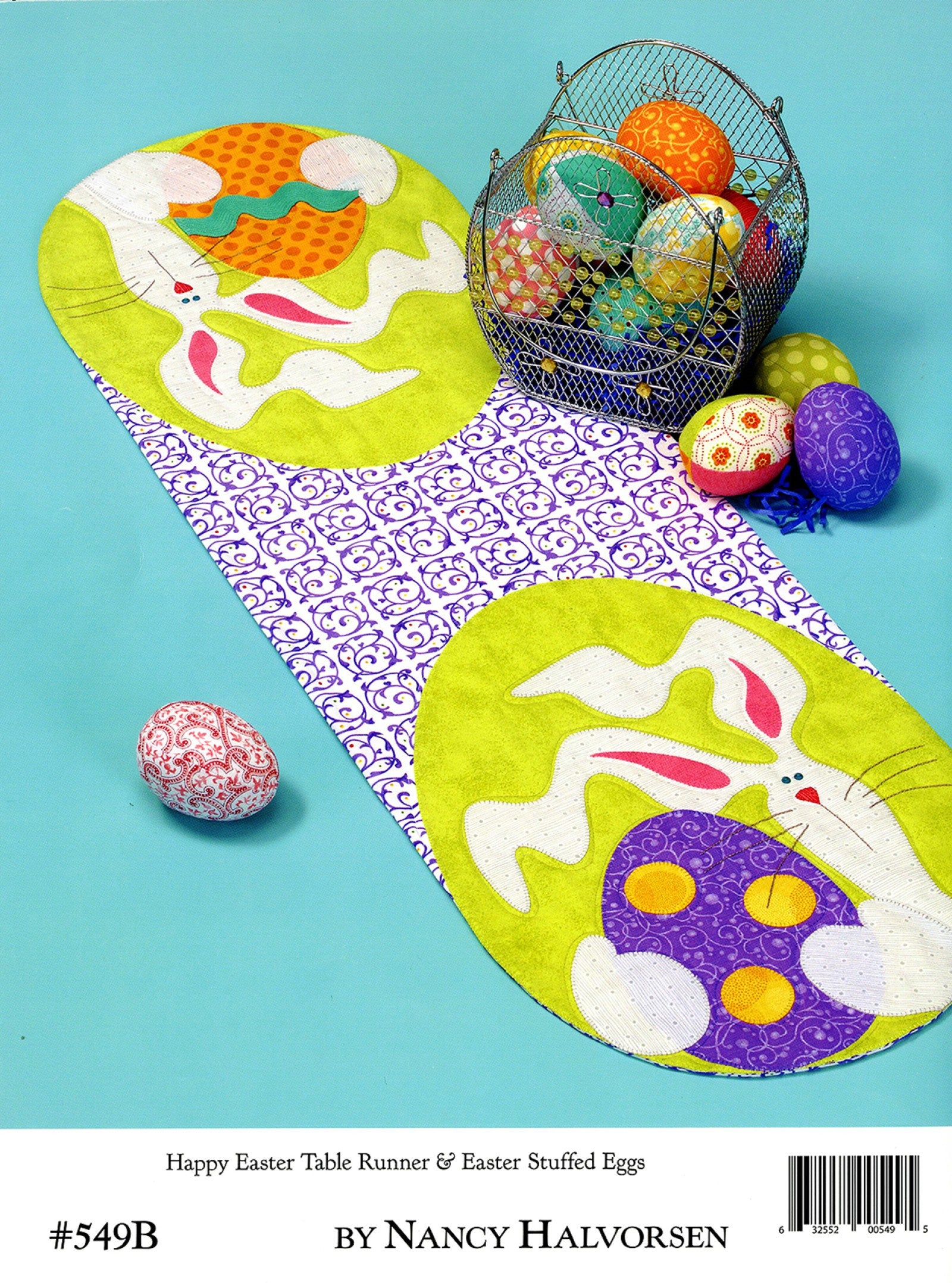 Back cover of the Table Please Part One quilt pattern book by Nancy Halvorsen of Art to Heart, showing the Happy Easter table runner with appliqued bunnies and stuffed Easter eggs. Marked number 549B by Nancy Halvorsen.