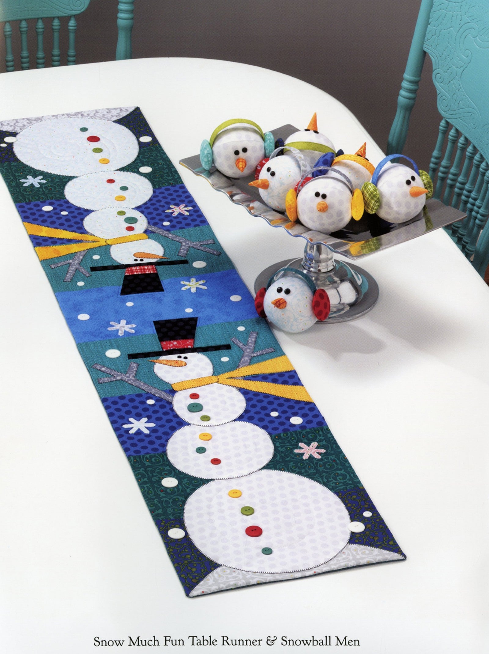 Interior page of the Table Please Part Two quilt pattern book by Nancy Halvorsen of Art to Heart, showing the Snow Much Fun table runner with appliqued snowmen and the Snowball Men.
