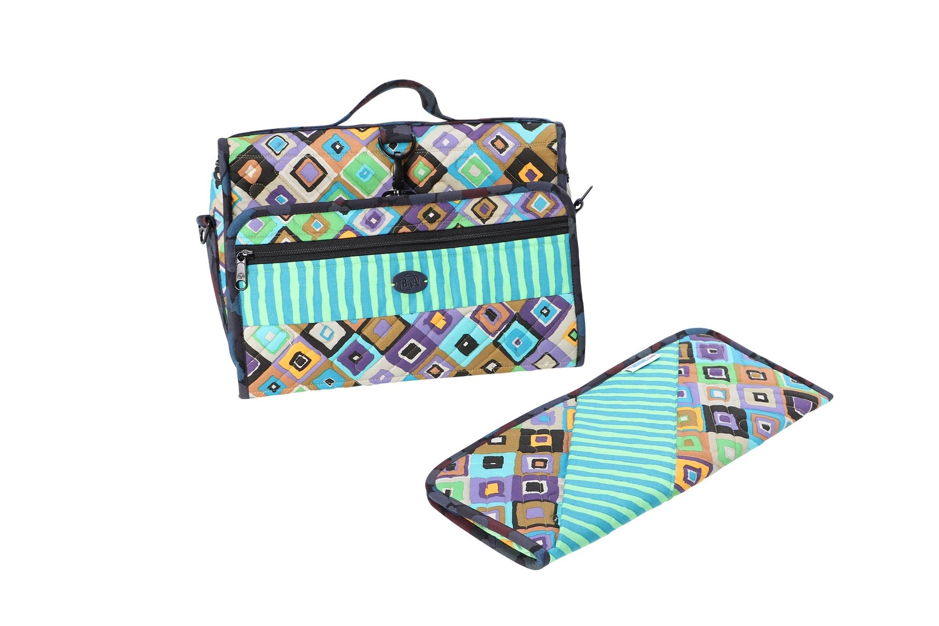 A Travel Essentials organizer folded into a compact case beside the flat hot tools sleeve.