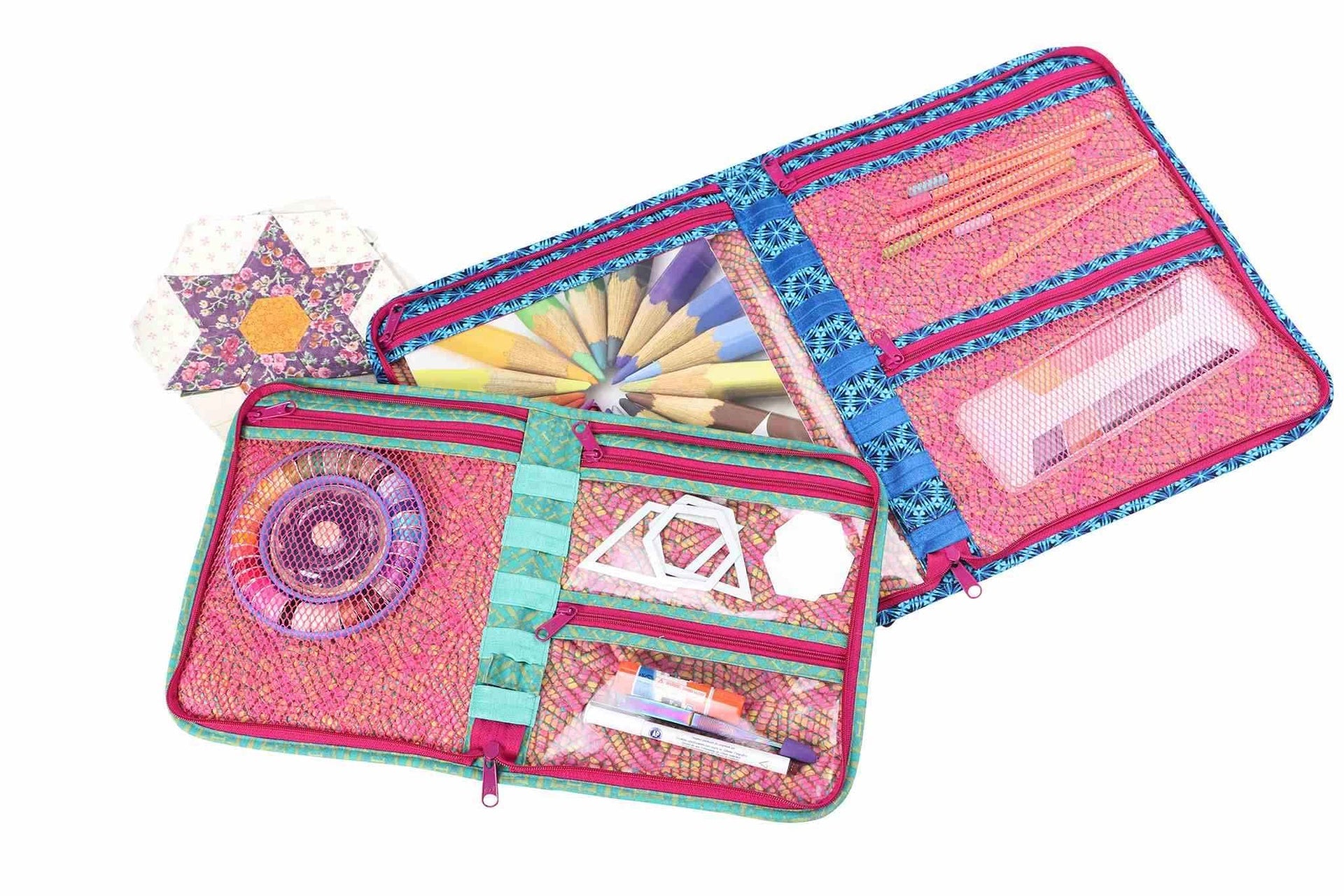 A Zip It Up organizer opened flat, showing zippered vinyl and mesh pockets packed with sewing notions.